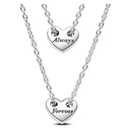Silver heart-shaped necklaces with 'Always' and 'Forever' engravings on a white background